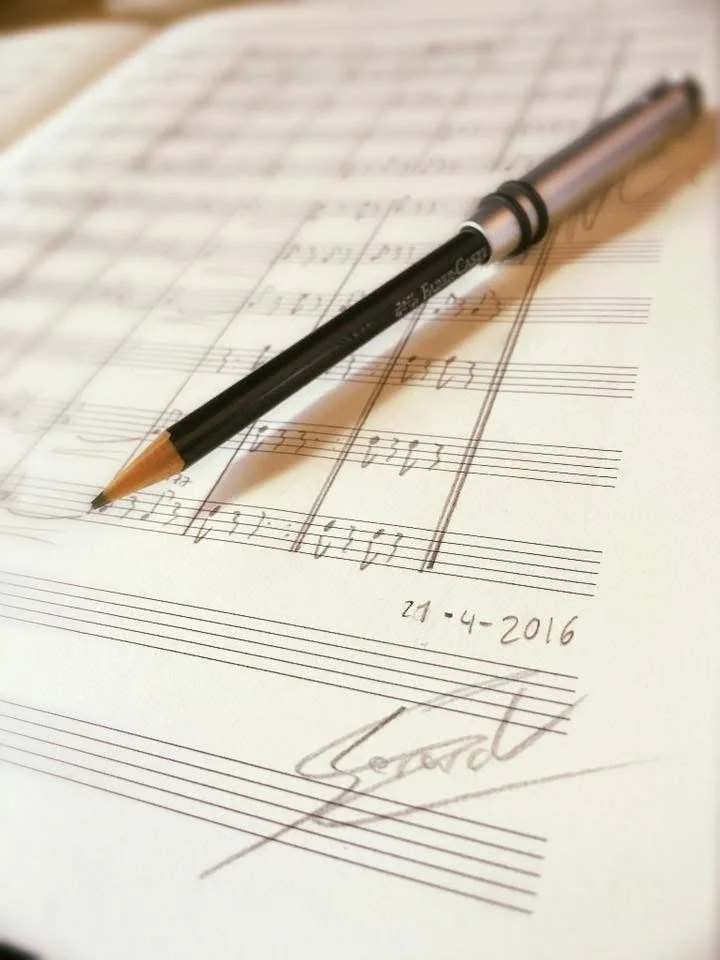Musical score with a pencil on top. The final double bar is visible, along with the date: 21/4/2016.
